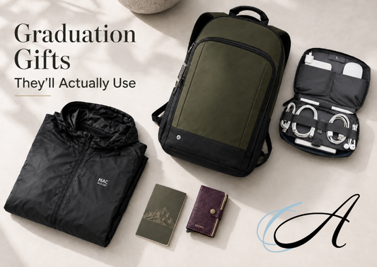 Practical graduation gifts including a travel bag, wallet, packable layer, socks, and everyday accessories.