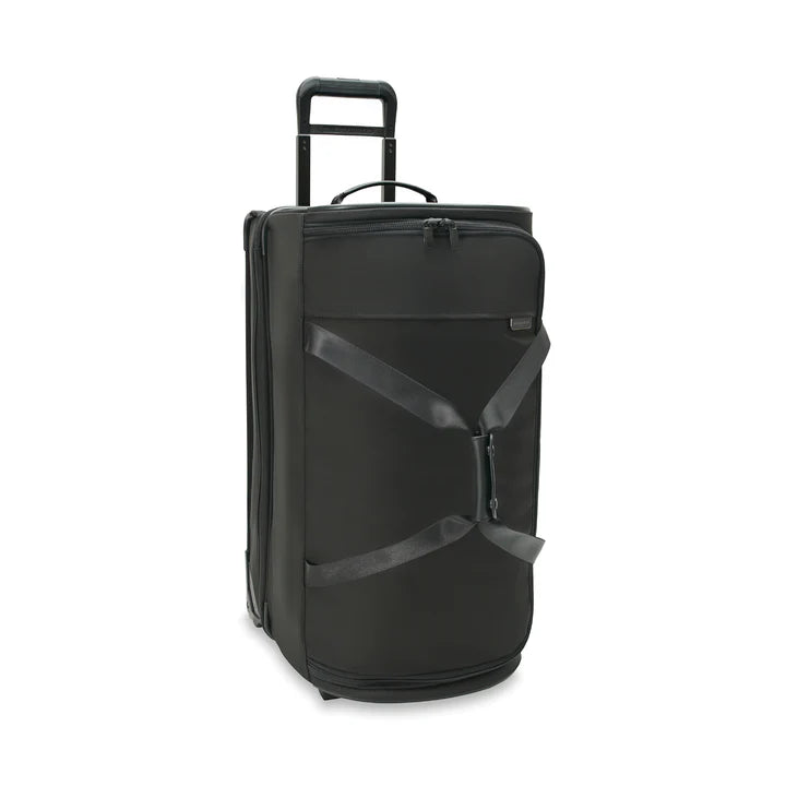 Black rolling suitcase on a white background